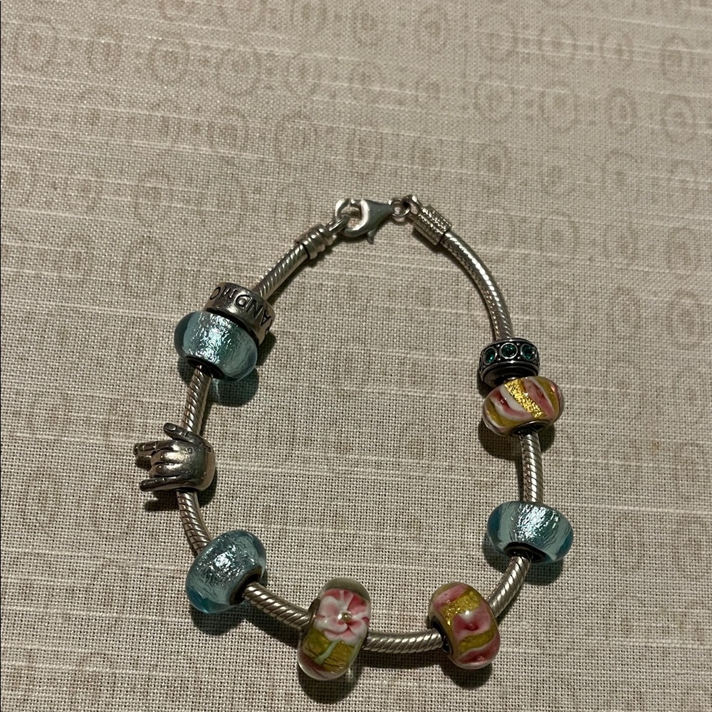 Pandora Elegant Silver Bracelet with 9 charms.